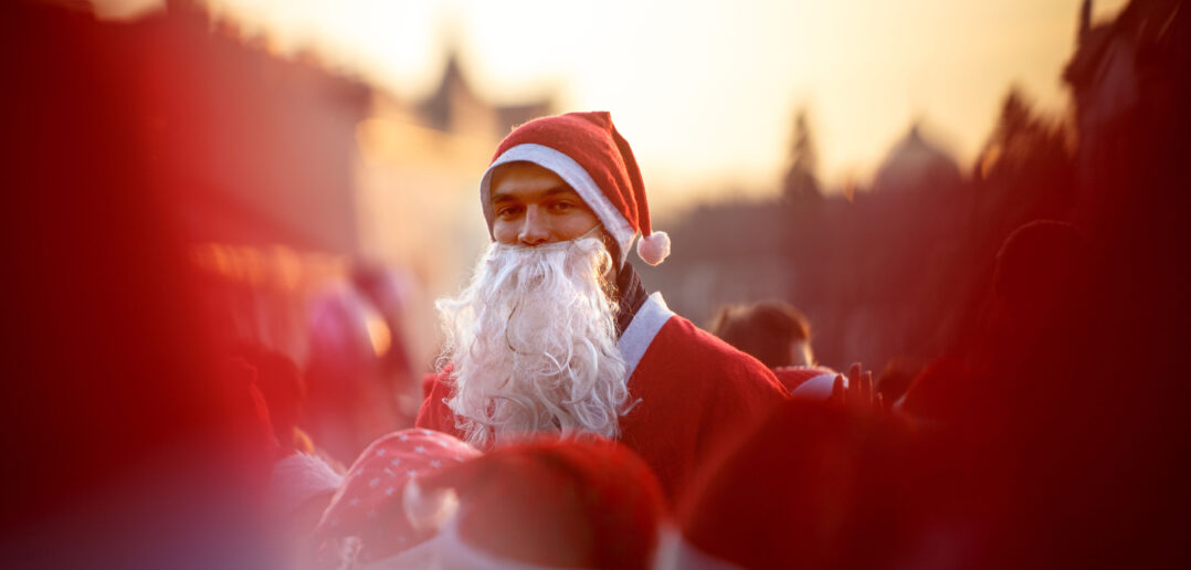 A young man dressed as Santa Claus