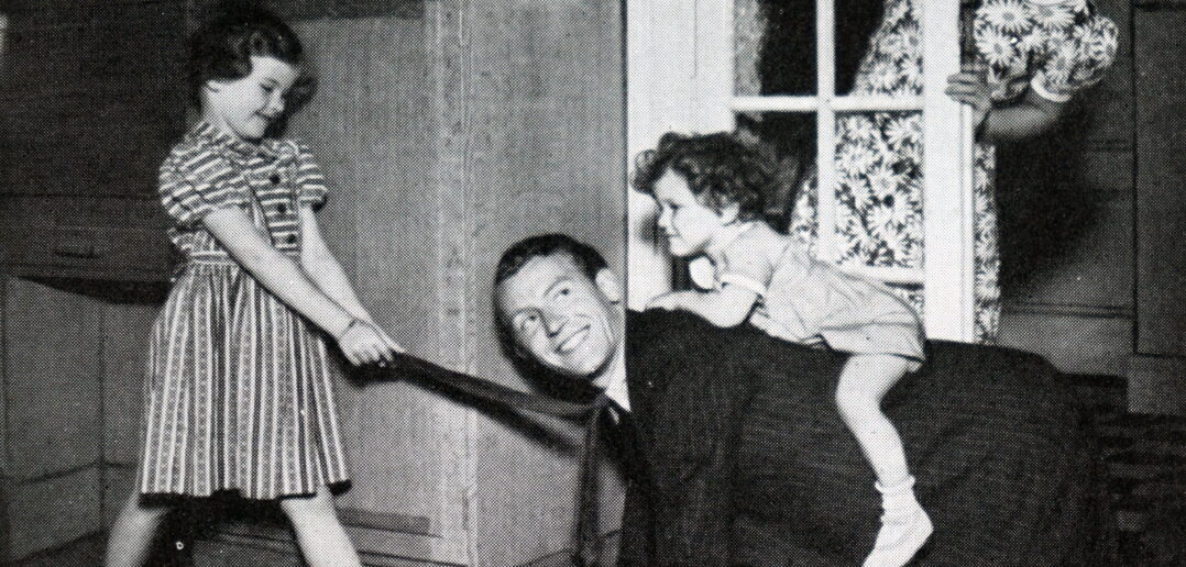 Brother and sister playing with their father. Illustration in a newspaper of family life in Britain in the 1950s