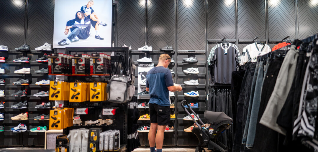 A customer views shoes at a Footlocker retail store