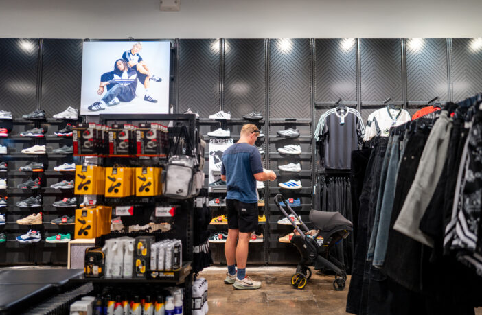 A customer views shoes at a Footlocker retail store